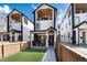 Modern two-story home with a small front lawn and a cozy porch area, in a modern style neighborhood at 2136 S Josephine St, Denver, CO 80210