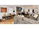 Inviting living room featuring a comfortable gray sofa, a fireplace, and an open layout that flows into the dining area at 2136 S Josephine St, Denver, CO 80210