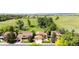 A beautiful aerial view of the property surrounded by lush greenery and mature trees, offering a serene atmosphere at 11241 E Cimmarron Dr, Englewood, CO 80111