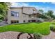 Well-maintained backyard with lush green grass and an outdoor deck, perfect for enjoying outdoor activities and leisure at 11241 E Cimmarron Dr, Englewood, CO 80111