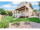 Multi-tiered deck in a landscaped backyard, creating an ideal outdoor living space for relaxation and entertaining at 11241 E Cimmarron Dr, Englewood, CO 80111