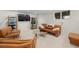 Cozy finished basement featuring neutral walls, plush carpeting, and comfortable seating area for entertainment at 11241 E Cimmarron Dr, Englewood, CO 80111