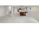 Spacious basement with a large carpeted area featuring a pool table and a stairway at 11241 E Cimmarron Dr, Englewood, CO 80111