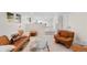 Inviting basement with a comfy seating area, a glass coffee table, and neutral finishes for relaxation and entertainment at 11241 E Cimmarron Dr, Englewood, CO 80111