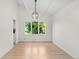 Dining room showcasing hardwood floors and a large window to the backyard at 11241 E Cimmarron Dr, Englewood, CO 80111