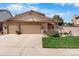 Charming home featuring a stone facade, two-car garage, and beautifully landscaped front yard in a great neighborhood at 11241 E Cimmarron Dr, Englewood, CO 80111
