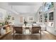 Bright and airy living room with vaulted ceilings, large windows, and neutral decor for a modern and relaxing atmosphere at 11241 E Cimmarron Dr, Englewood, CO 80111