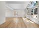Bright living room featuring hardwood floors, large windows, and high ceilings for an airy and inviting atmosphere at 11241 E Cimmarron Dr, Englewood, CO 80111