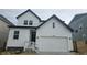 Charming two-story home featuring a bright white exterior and a convenient two-car garage at 16498 W 92Nd Pl, Arvada, CO 80007