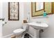 Cozy powder room with decorative mirror and pedestal sink at 562 N Gilpin St, Denver, CO 80218