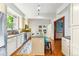 Bright kitchen features an island with granite counters, stainless appliances, and hardwood floors at 562 N Gilpin St, Denver, CO 80218