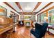 Cozy living room with hardwood floors, fireplace, wood ceiling beams, and natural light at 562 N Gilpin St, Denver, CO 80218