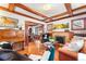 Spacious living room featuring hardwood floors, fireplace, wood ceiling beams, and comfortable seating at 562 N Gilpin St, Denver, CO 80218