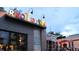 Root Down restaurant exterior featuring a modern design with brick, glass, and decorative lighting at 3321 Navajo St, Denver, CO 80211