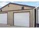 Two-car garage with white doors and clean exterior featuring ample space at 3321 Navajo St, Denver, CO 80211