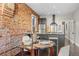 Eat-in kitchen area with an island and dark cabinets at 3321 Navajo St, Denver, CO 80211