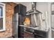 Kitchen with stainless steel appliances and dark cabinets at 3321 Navajo St, Denver, CO 80211