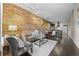 Inviting living room with exposed brick wall, comfortable seating, and stylish decor at 3321 Navajo St, Denver, CO 80211