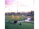 Scenic park view at sunset featuring lush green lawns, walking paths, and city views in the distance at 3321 Navajo St, Denver, CO 80211