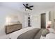 Spacious bedroom with ceiling fan, neutral walls, carpet and light wood dresser, offering a peaceful retreat at 3550 S Harlan St # 177, Denver, CO 80235