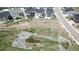 Aerial view shows pond area and surrounding green space near neighborhood homes at 4536 Shady Path Ln, Castle Rock, CO 80104