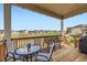 Relax on the covered back deck with views of the neighborhood, perfect for outdoor dining and gatherings at 4536 Shady Path Ln, Castle Rock, CO 80104