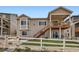 Beautiful backyard features a deck with a staircase, patio, and a fenced yard at 4536 Shady Path Ln, Castle Rock, CO 80104
