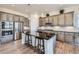 Modern kitchen with a spacious island, stainless steel appliances, and custom cabinets, perfect for entertaining at 4536 Shady Path Ln, Castle Rock, CO 80104