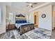Spacious main bedroom features tray ceilings, a ceiling fan, and an en-suite bathroom, providing a relaxing retreat at 4536 Shady Path Ln, Castle Rock, CO 80104