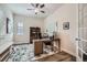 Comfortable home office space with natural light, a ceiling fan, and plenty of room for shelving and a desk at 4536 Shady Path Ln, Castle Rock, CO 80104