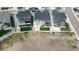 Overhead view of suburban homes with backyard patios, fresh green lawns, and white picket fences at 4536 Shady Path Ln, Castle Rock, CO 80104