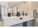 Elegant bathroom featuring double vanity, modern sinks, and a sleek, glass-enclosed shower at 6550 S Oak Ct, Littleton, CO 80127