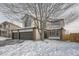 Beautiful home with a three-car garage and brick accents, set in a peaceful neighborhood and mature landscaping at 6550 S Oak Ct, Littleton, CO 80127