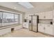 Bright kitchen with stainless steel appliances, a window seat, and a skylight at 6550 S Oak Ct, Littleton, CO 80127