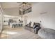 Open-concept living room with a vaulted ceiling and a view of the kitchen at 6550 S Oak Ct, Littleton, CO 80127