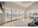 Open floor plan with living area, kitchen, and large sliding doors to the outdoor patio at 6550 S Oak Ct, Littleton, CO 80127