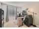Functional home office with a modern desk, multiple monitors, and a cozy window seat at 6550 S Oak Ct, Littleton, CO 80127