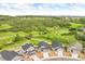 Overhead view of homes surrounded by lush landscape and walking trails at 4418 Soapberry Pl, Castle Rock, CO 80108