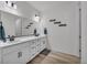 Bathroom with double sinks, vanity, and artwork at 4418 Soapberry Pl, Castle Rock, CO 80108