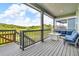 Spacious covered deck with ample seating and beautiful views at 4418 Soapberry Pl, Castle Rock, CO 80108