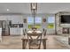 Elegant dining room adjacent to the kitchen, featuring stylish decor and scenic views at 4418 Soapberry Pl, Castle Rock, CO 80108