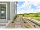 Exterior side view of home with walkway and lush landscaping at 4418 Soapberry Pl, Castle Rock, CO 80108