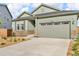 Charming home with a two-car garage and well-manicured lawn at 4418 Soapberry Pl, Castle Rock, CO 80108