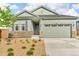 Charming home featuring stone accents, landscaped yard, and a two-car garage in a Gathering-friendly neighborhood at 4418 Soapberry Pl, Castle Rock, CO 80108