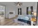 Bright bedroom with a ceiling fan, hardwood floors, curtains, and a great exterior view at 4418 Soapberry Pl, Castle Rock, CO 80108