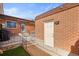 Charming backyard features brick architecture, and a well maintained lawn at 770 S Youngfield, Lakewood, CO 80228