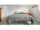 Bedroom with soft carpet, side table with lamp, and three-piece mountain artwork at 770 S Youngfield, Lakewood, CO 80228