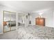 Spacious bedroom featuring large mirrored closets and neutral carpeting at 770 S Youngfield, Lakewood, CO 80228