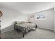 Inviting bedroom with a comfortable bed, soft carpeting, and a bright window at 770 S Youngfield, Lakewood, CO 80228