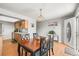 Bright dining area with wood floors adjacent to kitchen at 770 S Youngfield, Lakewood, CO 80228